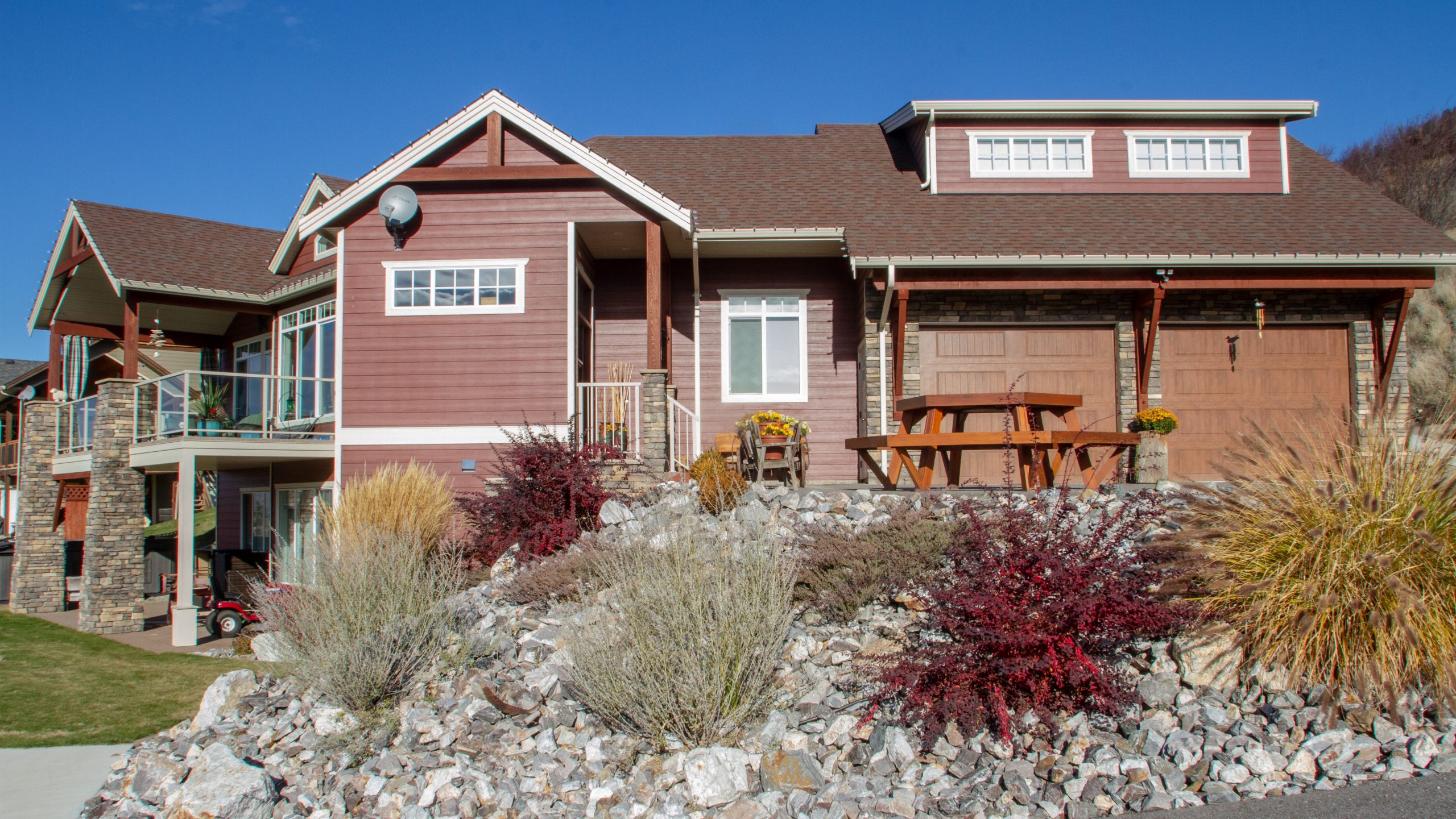 custom home curb appeal with angled garage