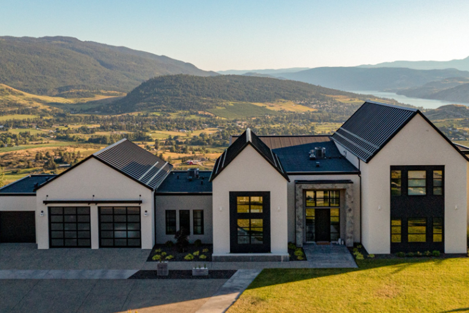 modern custom home overlooking scenic mountain landscape. vernon builder.